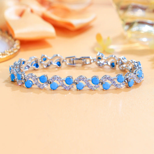 Vintage elegant court style blue turquoise S-shaped interlocking bracelet with high-end luxury feel and zirconium gemstone inlay