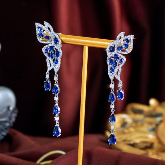 S925 silver needle long-style butterfly fringed earrings enhance facial shape and temperament They resemble a pair of flying swallows Drop earrings as an accessory for the ears
