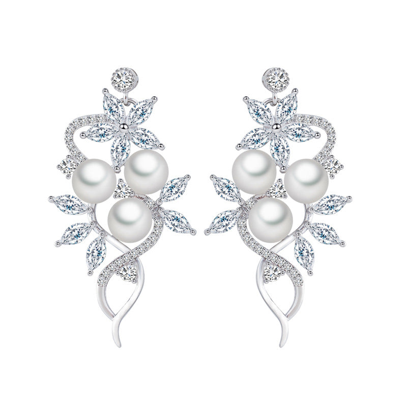 Korean high-class lady's pearl fringed drop earrings featuring mother-of-pearl elegant and sophisticated long-stemmed diamond-set earrings