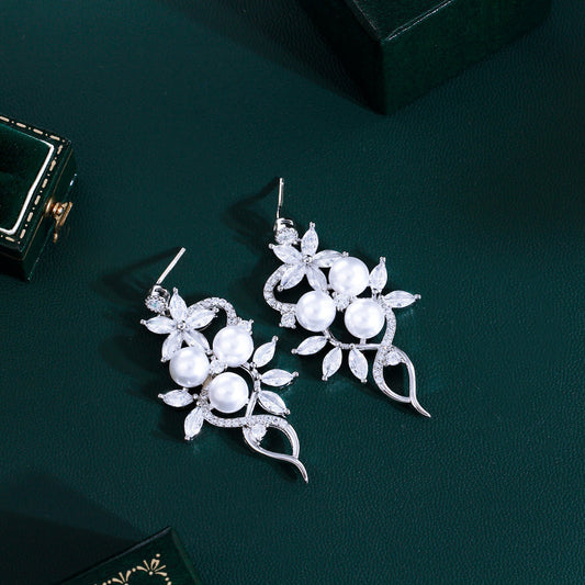 Korean high-class lady's pearl fringed drop earrings featuring mother-of-pearl elegant and sophisticated long-stemmed diamond-set earrings