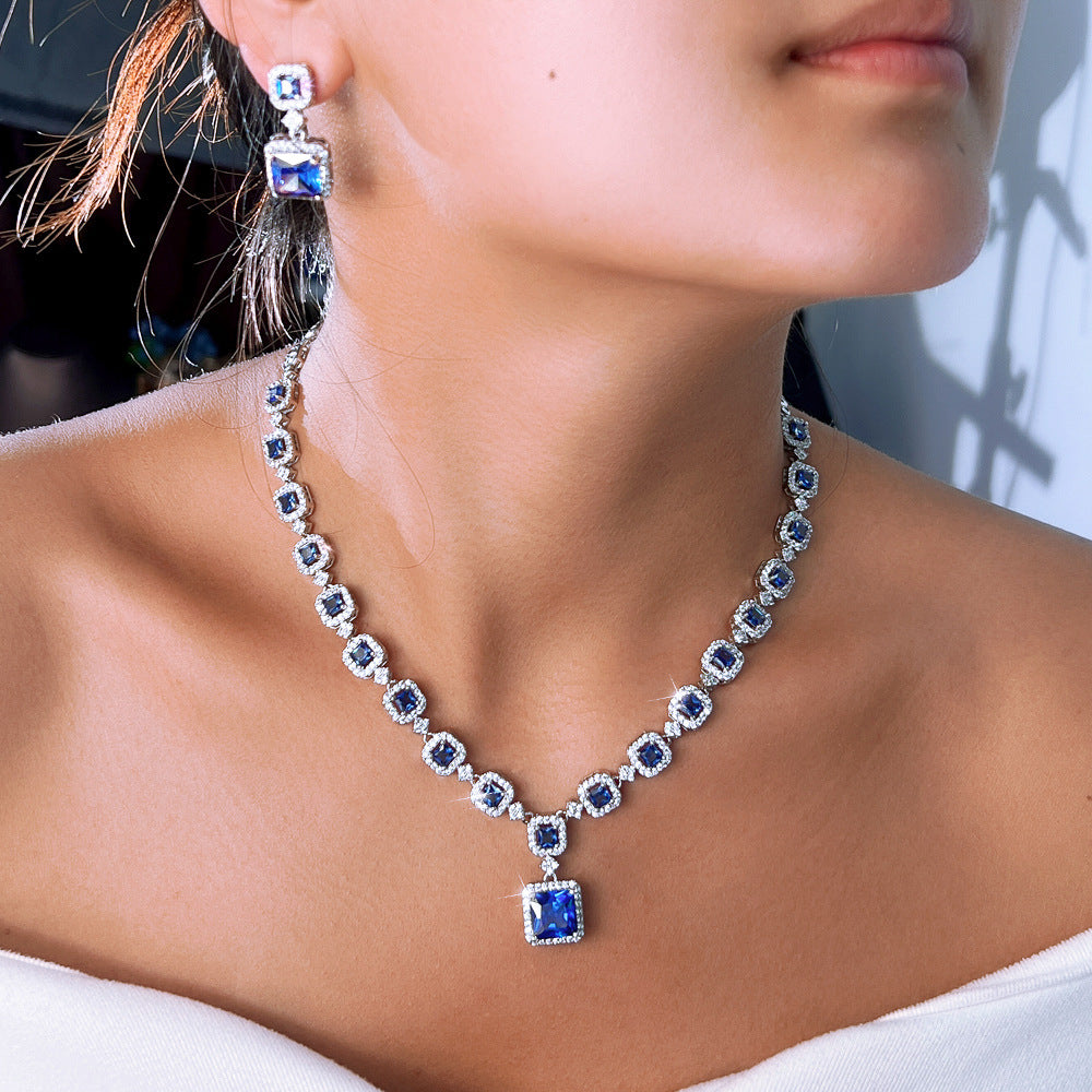 High-end luxury jewelry set featuring exquisite square zirconia pieces This includes a wedding dress necklace earrings and a matching chain perfect for an elegant evening event