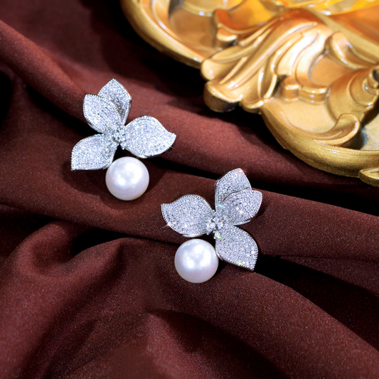 S925 silver needle luxury petal pearl earrings, small-scale design with unique style, exudes a sense of sophistication. Flower-shaped zirconia earrings as an accessory.