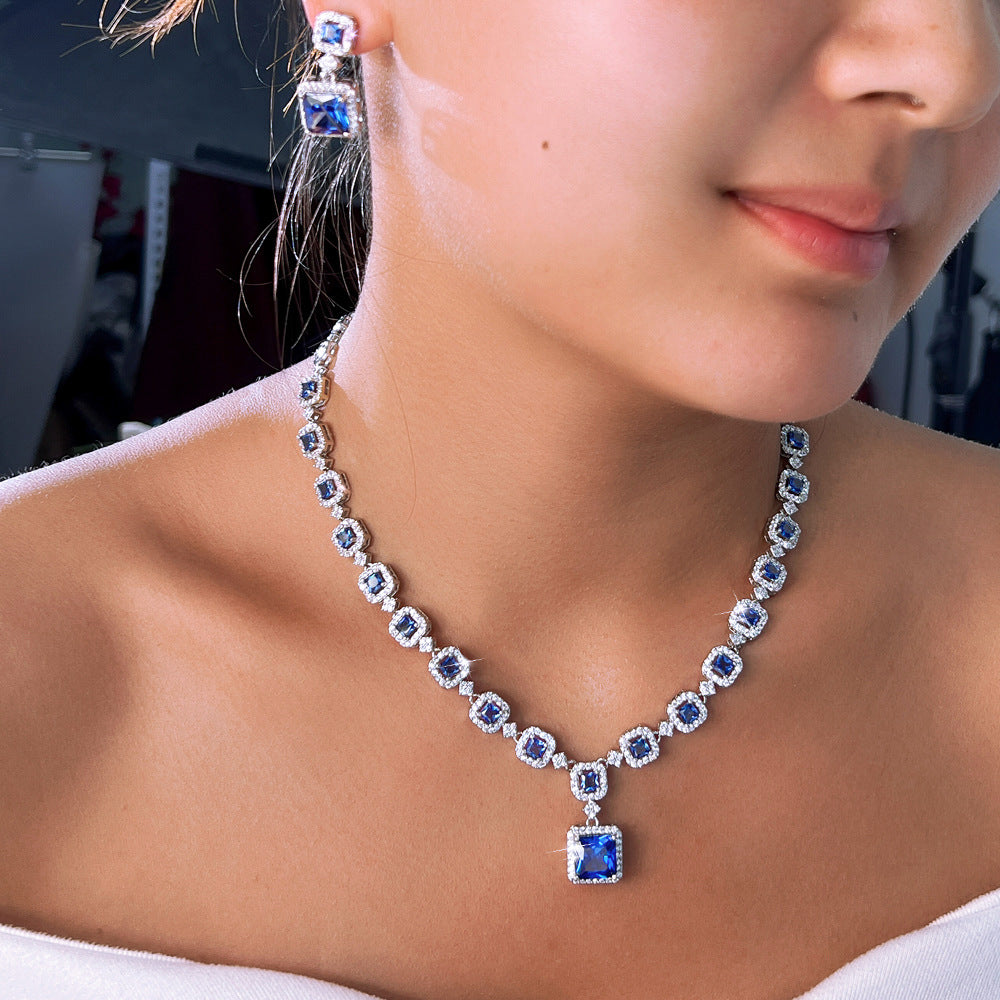 High-end luxury jewelry set featuring exquisite square zirconia pieces This includes a wedding dress necklace earrings and a matching chain perfect for an elegant evening event