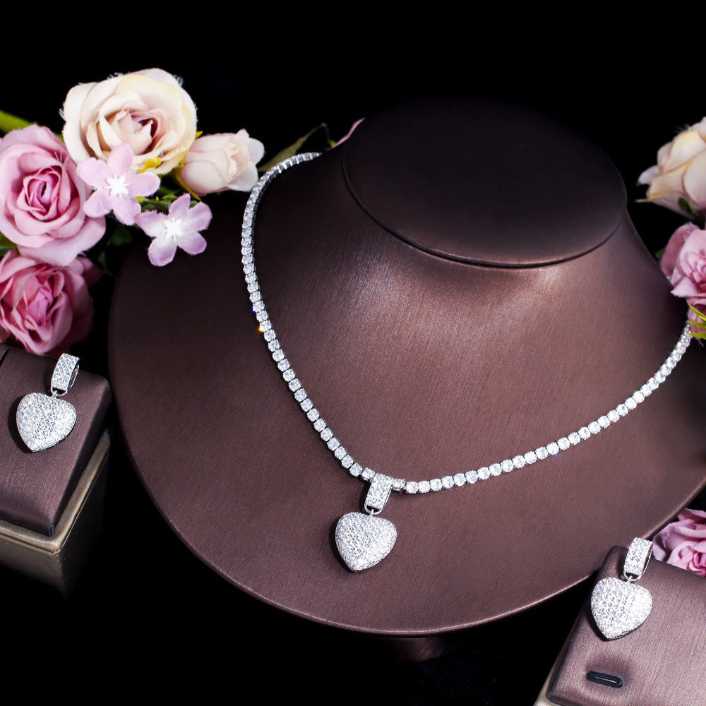 Two sets of matching earrings and necklaces featuring Korean-style pop-style heart-shaped micro-set zirconia and full diamonds This set is suitable for wedding brides and heart-shaped pendant necklaces