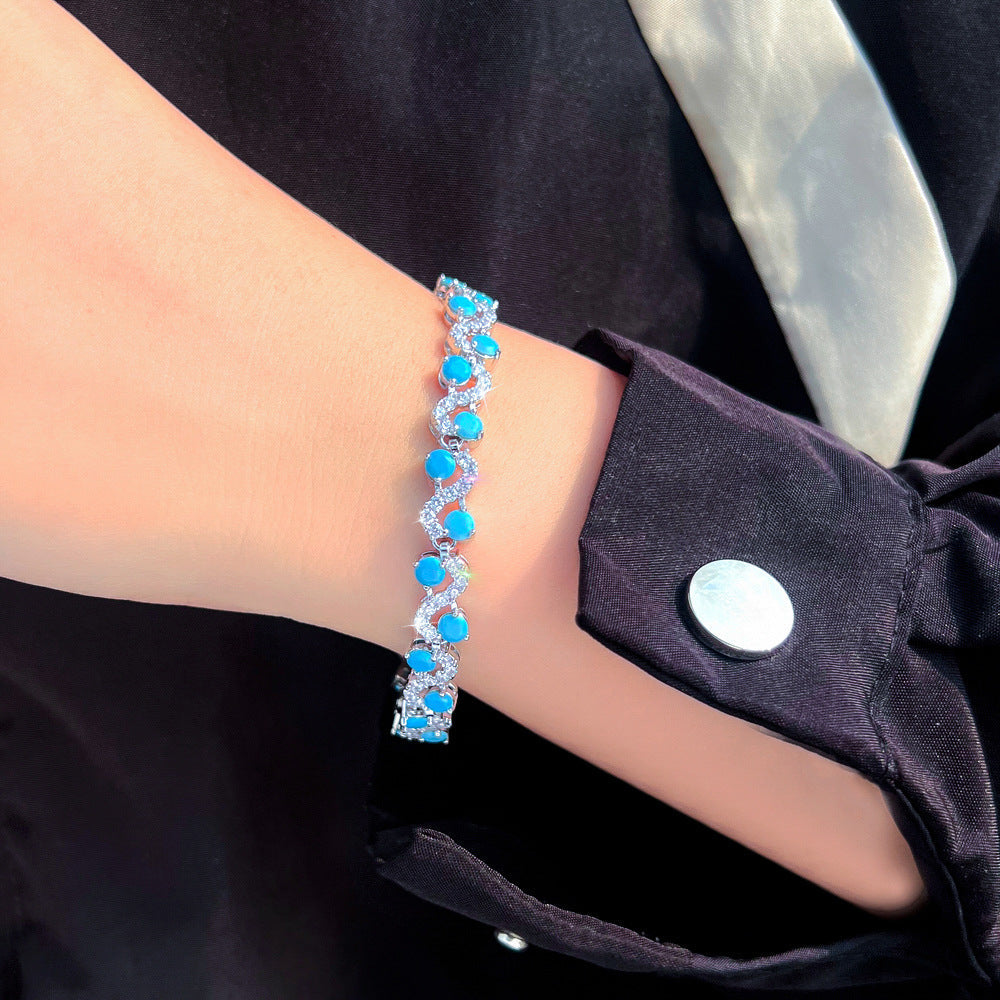 Vintage elegant court style blue turquoise S-shaped interlocking bracelet with high-end luxury feel and zirconium gemstone inlay