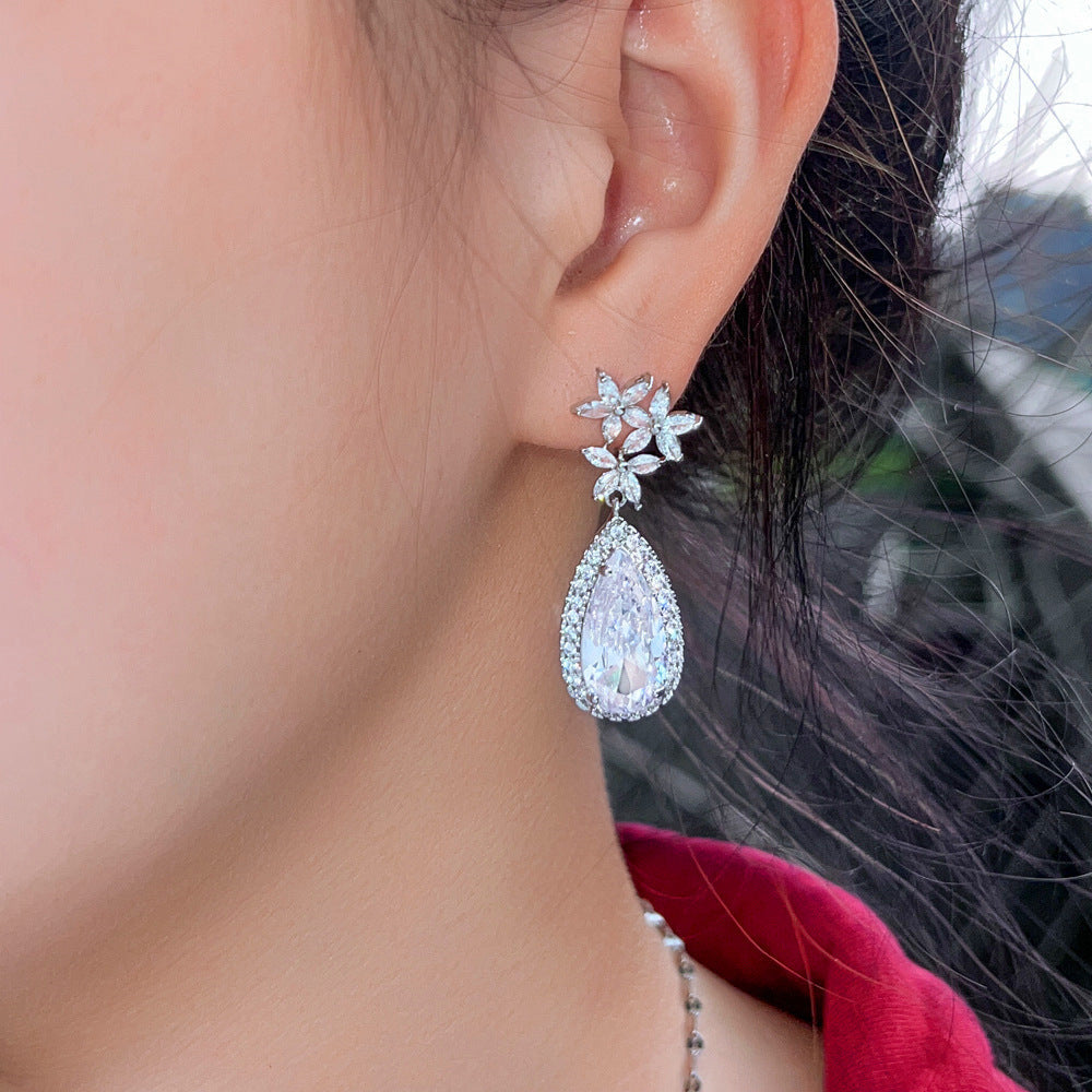 Classic flower-shaped zircon earrings with droplet-shaped micro-set pendants electroplated brass fashionable and trendy accessories