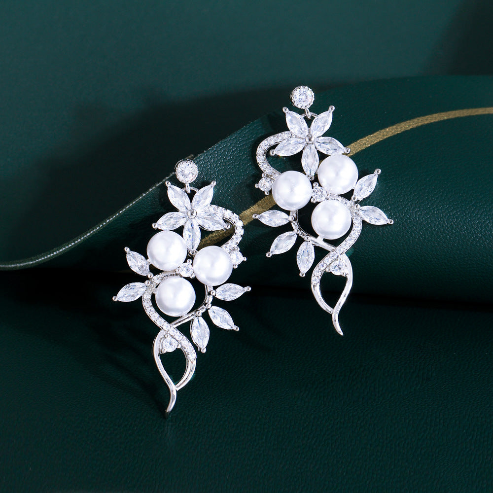 Korean high-class lady's pearl fringed drop earrings featuring mother-of-pearl elegant and sophisticated long-stemmed diamond-set earrings