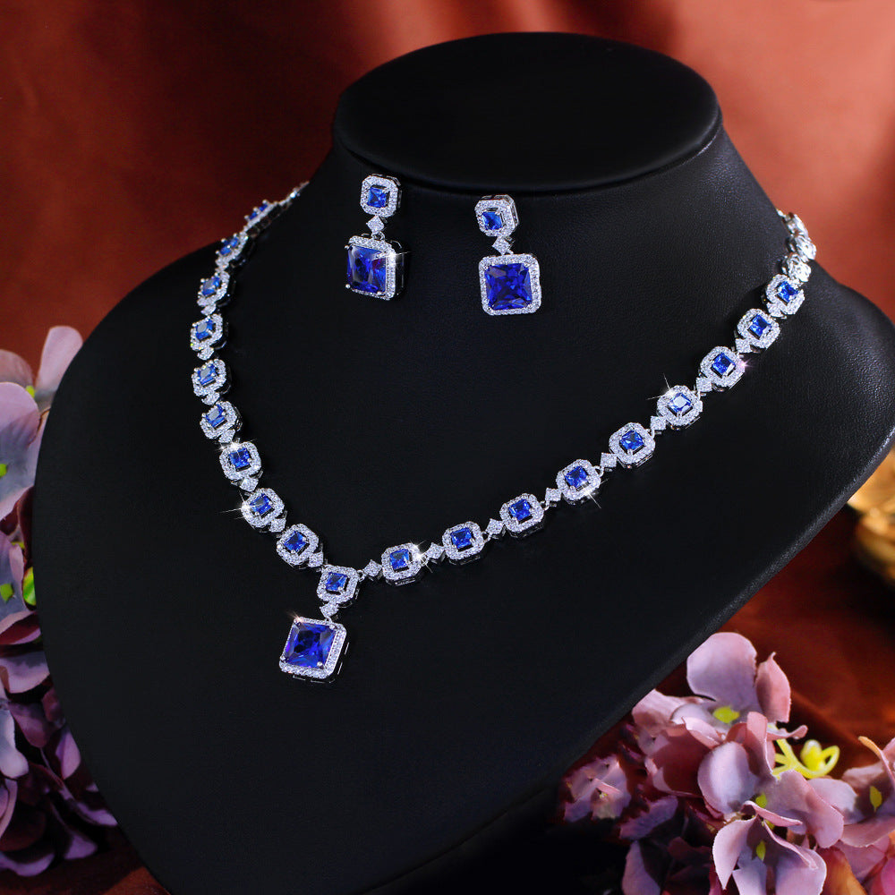 High-end luxury jewelry set featuring exquisite square zirconia pieces This includes a wedding dress necklace earrings and a matching chain perfect for an elegant evening event