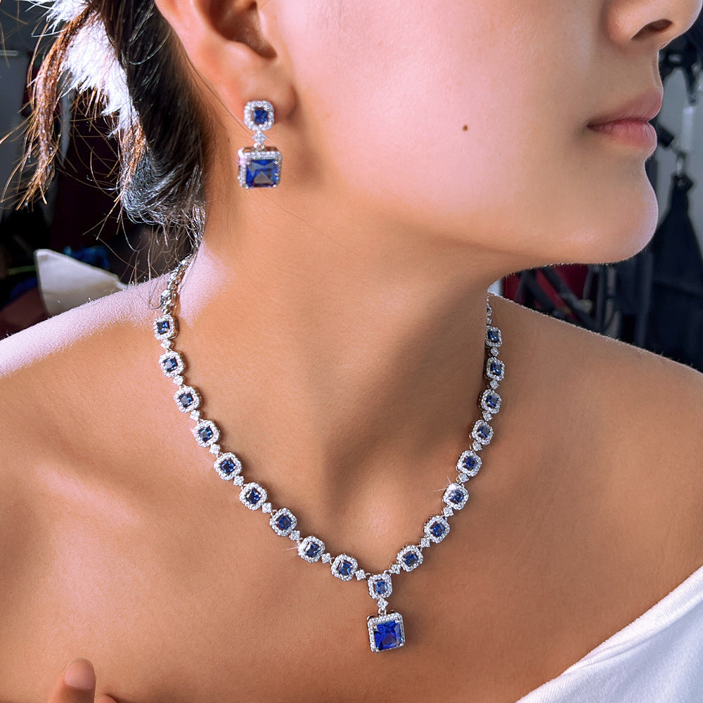 High-end luxury jewelry set featuring exquisite square zirconia pieces This includes a wedding dress necklace earrings and a matching chain perfect for an elegant evening event