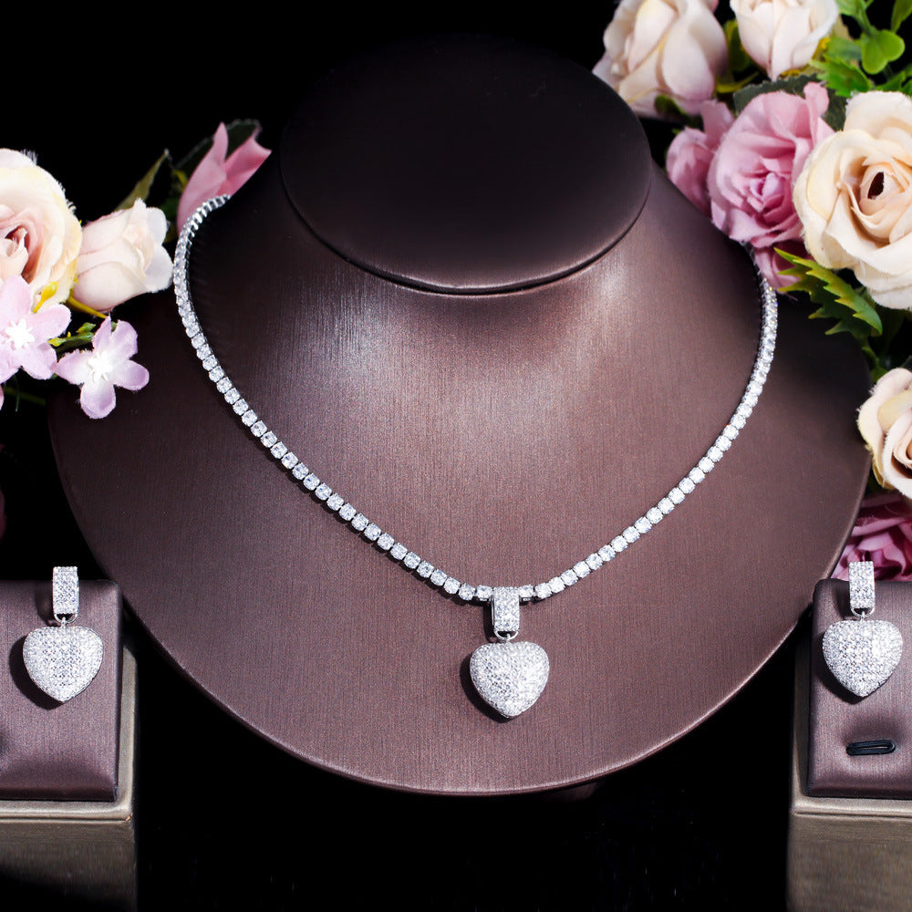 Two sets of matching earrings and necklaces featuring Korean-style pop-style heart-shaped micro-set zirconia and full diamonds This set is suitable for wedding brides and heart-shaped pendant necklaces