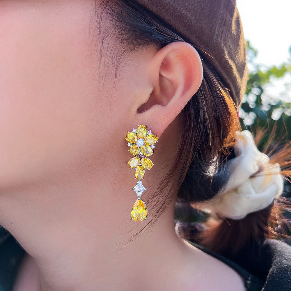 Japanese and Korean minimalist luxury long-flowing flower-shaped drop zirconia earrings with abundant diamonds, featuring elegant and versatile style, perfect for all occasions. Ear jewelry.