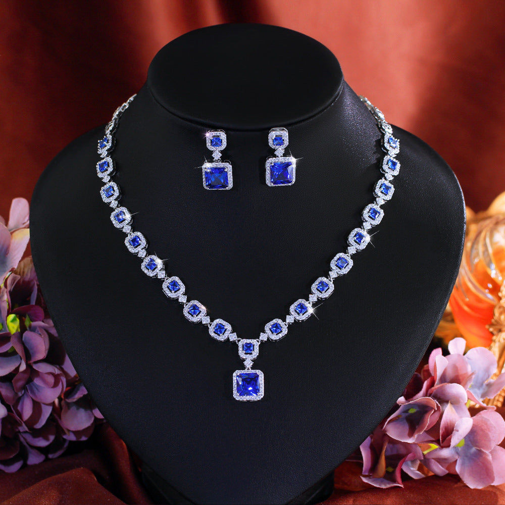 High-end luxury jewelry set featuring exquisite square zirconia pieces This includes a wedding dress necklace earrings and a matching chain perfect for an elegant evening event