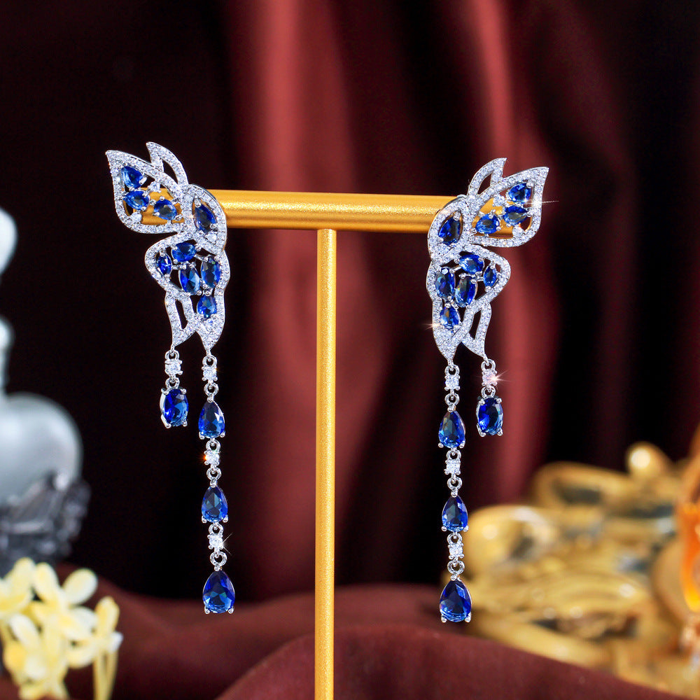 S925 silver needle long-style butterfly fringed earrings enhance facial shape and temperament They resemble a pair of flying swallows Drop earrings as an accessory for the ears