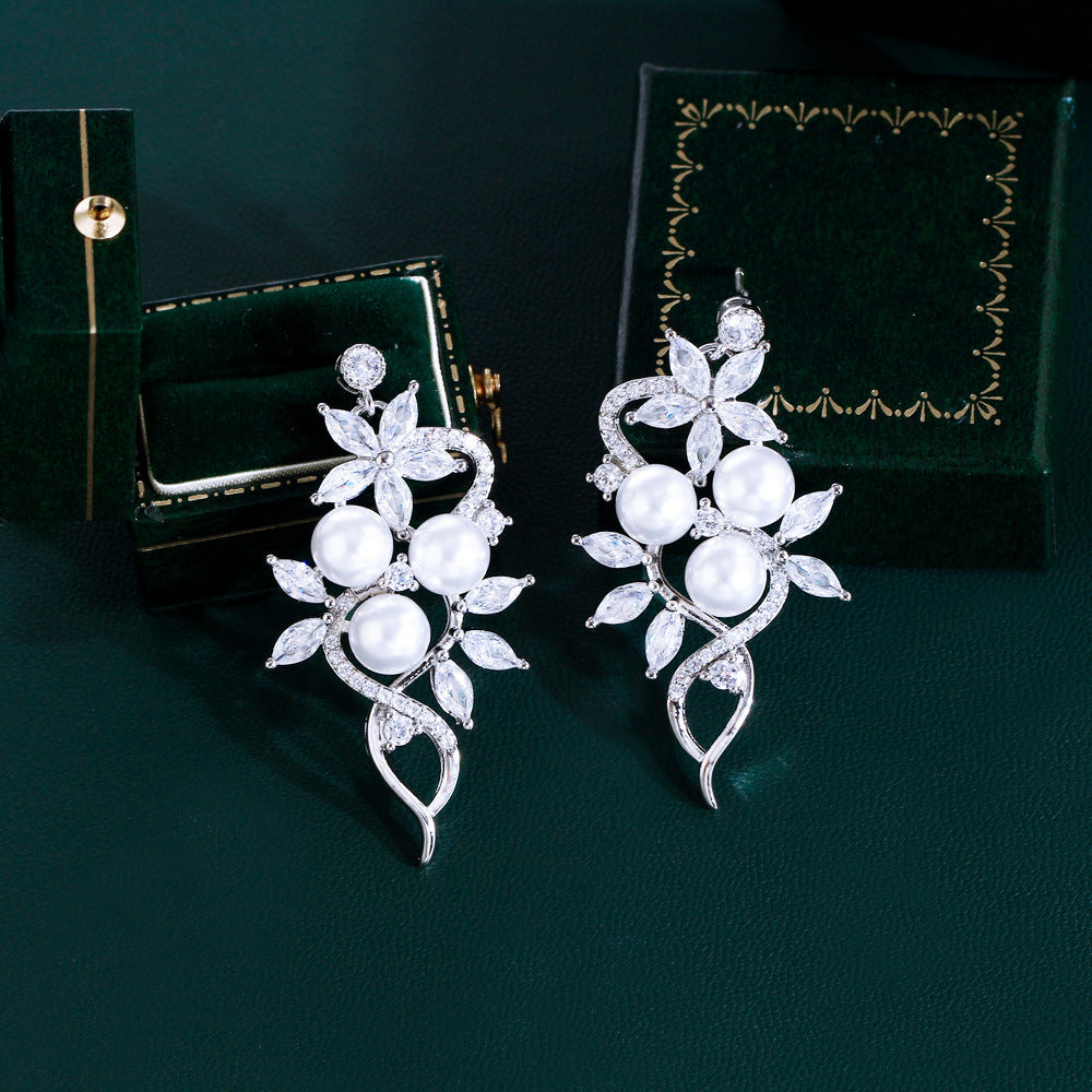 Korean high-class lady's pearl fringed drop earrings featuring mother-of-pearl elegant and sophisticated long-stemmed diamond-set earrings