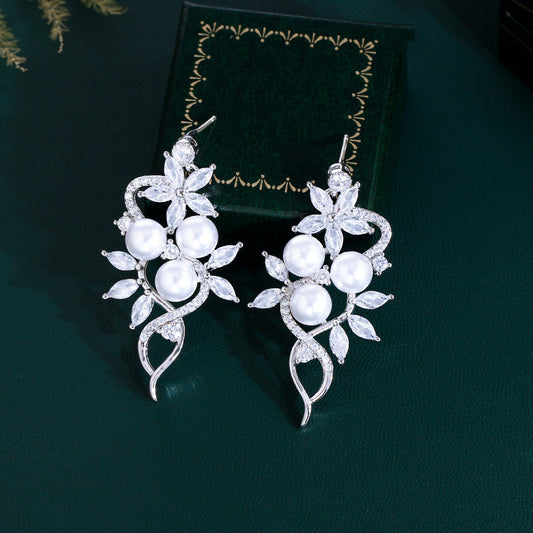 Korean high-class lady's pearl fringed drop earrings featuring mother-of-pearl elegant and sophisticated long-stemmed diamond-set earrings