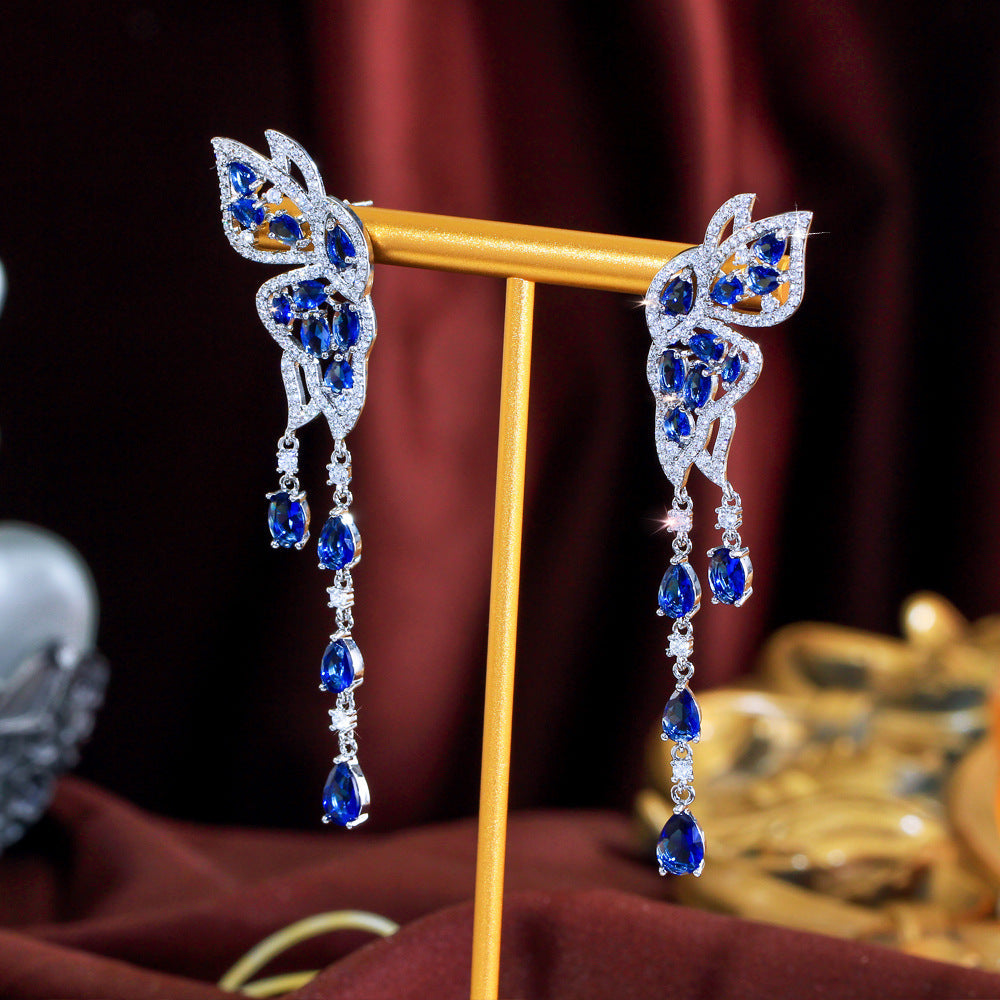 S925 silver needle long-style butterfly fringed earrings enhance facial shape and temperament They resemble a pair of flying swallows Drop earrings as an accessory for the ears