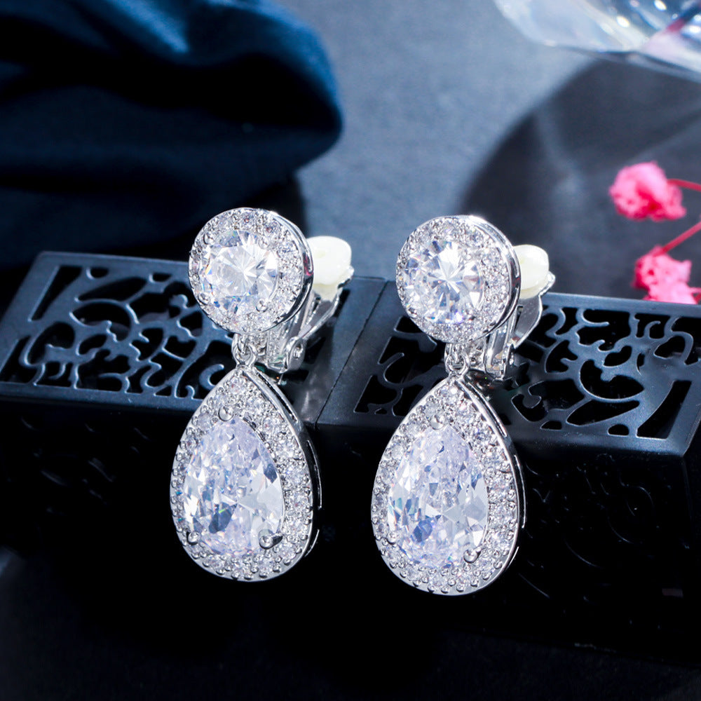 Simple and exclusive droplet-shaped ear clips with eight arrows and eight hearts set with AAA quality zirconia stones as an ear pendant