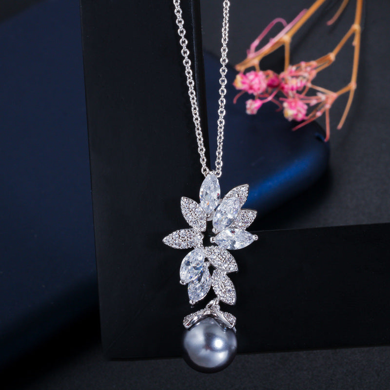 Korean-style fashion versatile S925 pure silver needle micro-set zirconia shell pearl necklace earrings and chain set. For women
