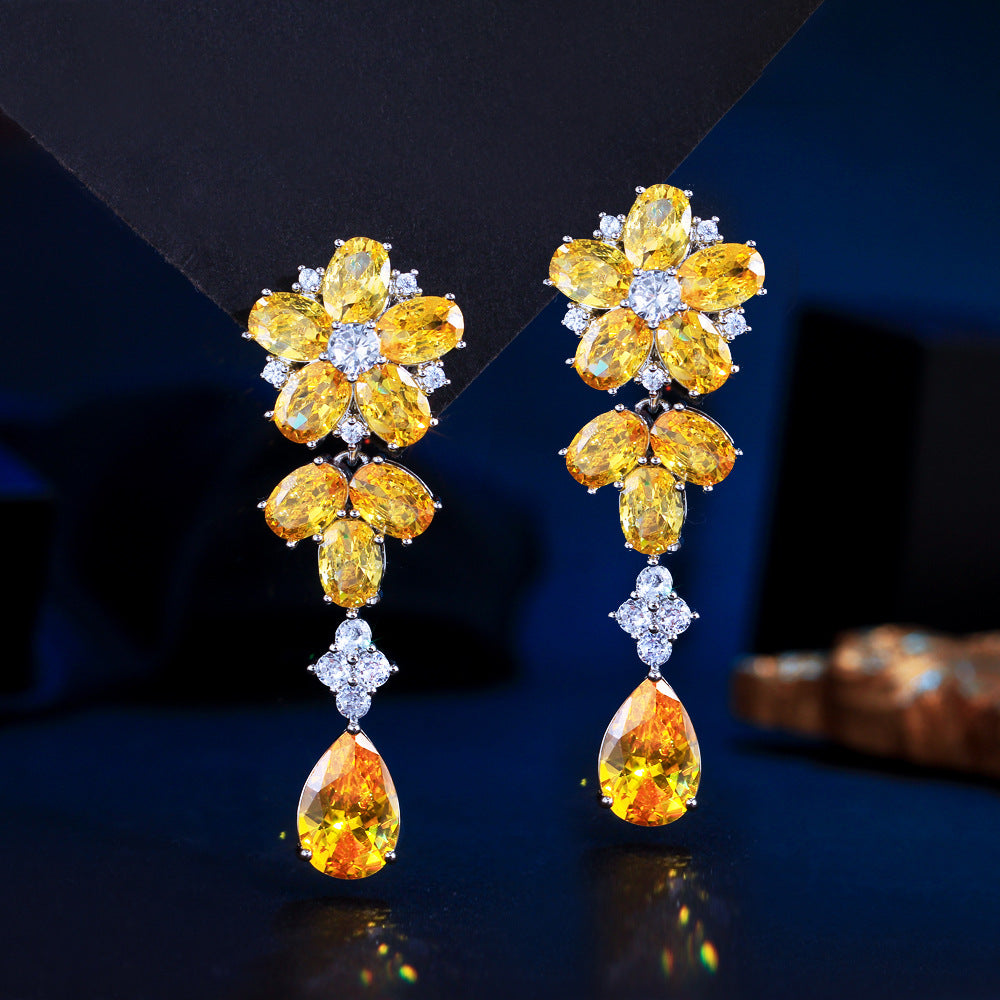 Japanese and Korean minimalist luxury long-flowing flower-shaped drop zirconia earrings with abundant diamonds, featuring elegant and versatile style, perfect for all occasions. Ear jewelry.