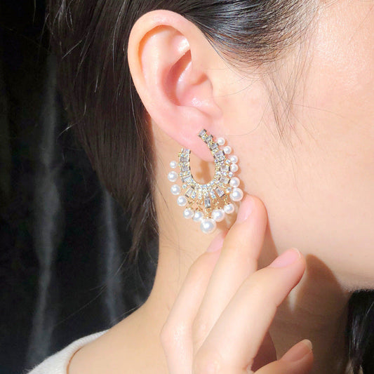 Korean fashionable pearl jewelry - S925 silver needle with micro-set zirconia hollow design luxurious lightweight earrings and ear pendants