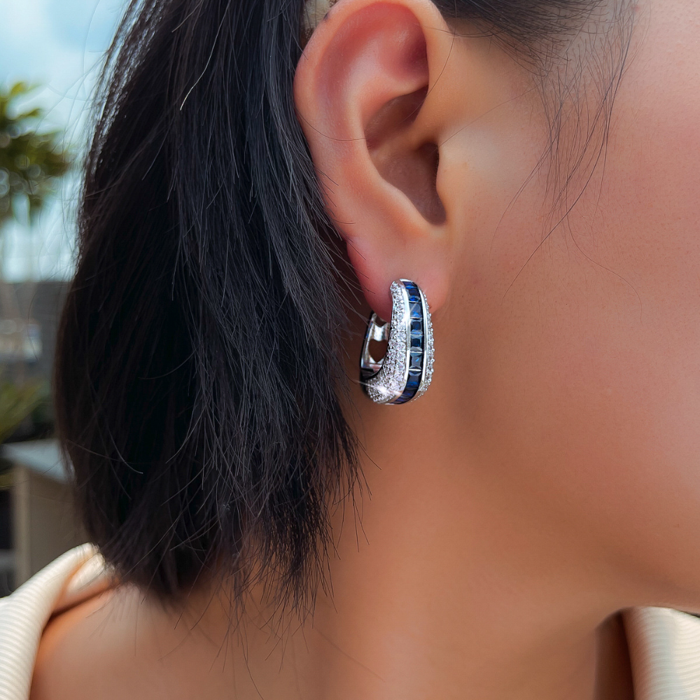European and American full-circle square-shaped ear studs featuring bright blue zirconia This is a fashionable luxurious niche design in a sweet and cool style It is an earpiece accessory