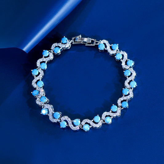 Vintage elegant court style blue turquoise S-shaped interlocking bracelet with high-end luxury feel and zirconium gemstone inlay