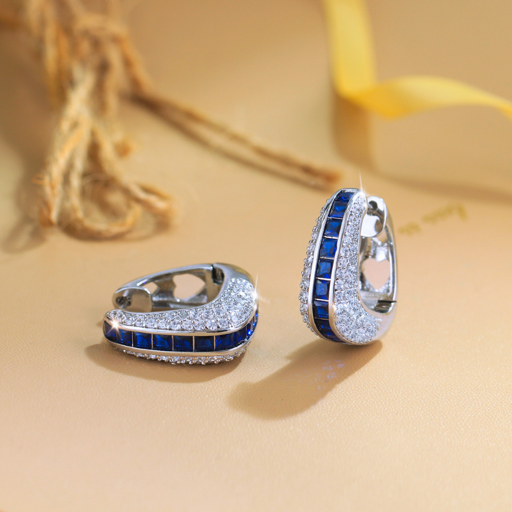 European and American full-circle square-shaped ear studs featuring bright blue zirconia This is a fashionable luxurious niche design in a sweet and cool style It is an earpiece accessory