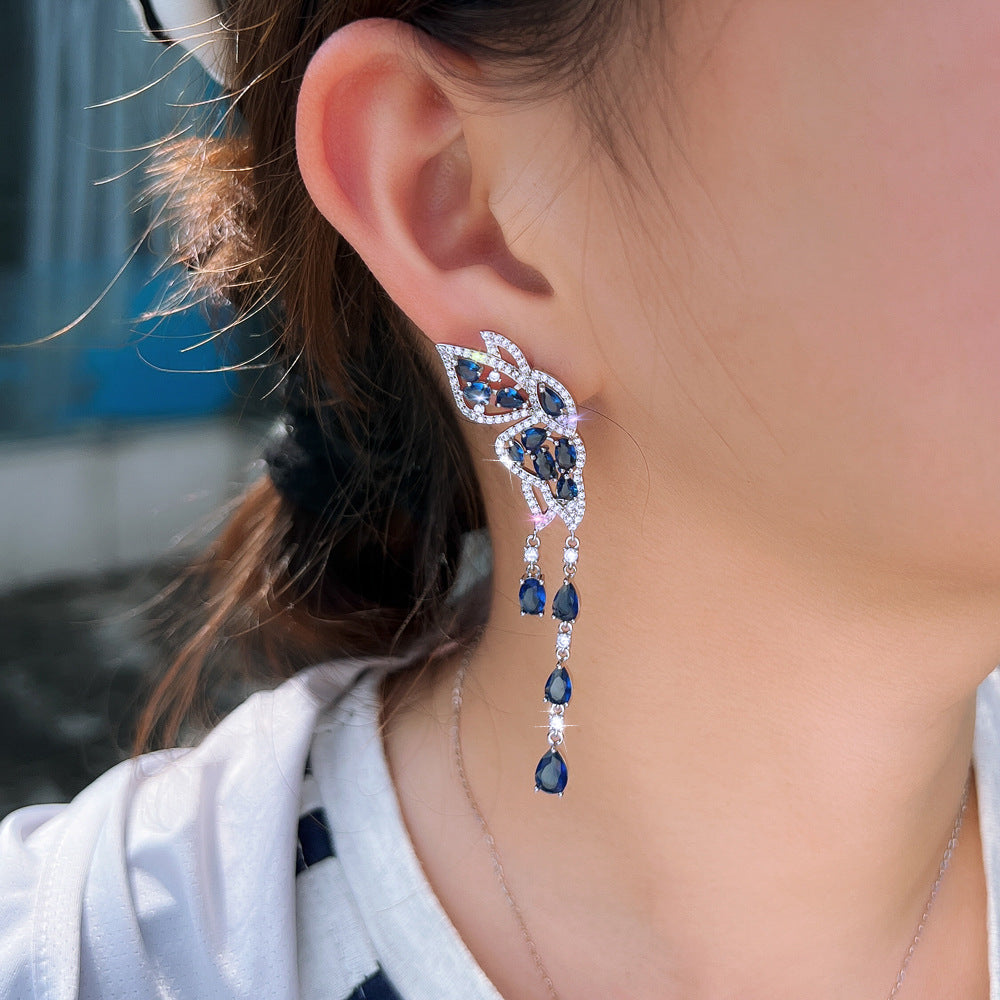 S925 silver needle long-style butterfly fringed earrings enhance facial shape and temperament They resemble a pair of flying swallows Drop earrings as an accessory for the ears