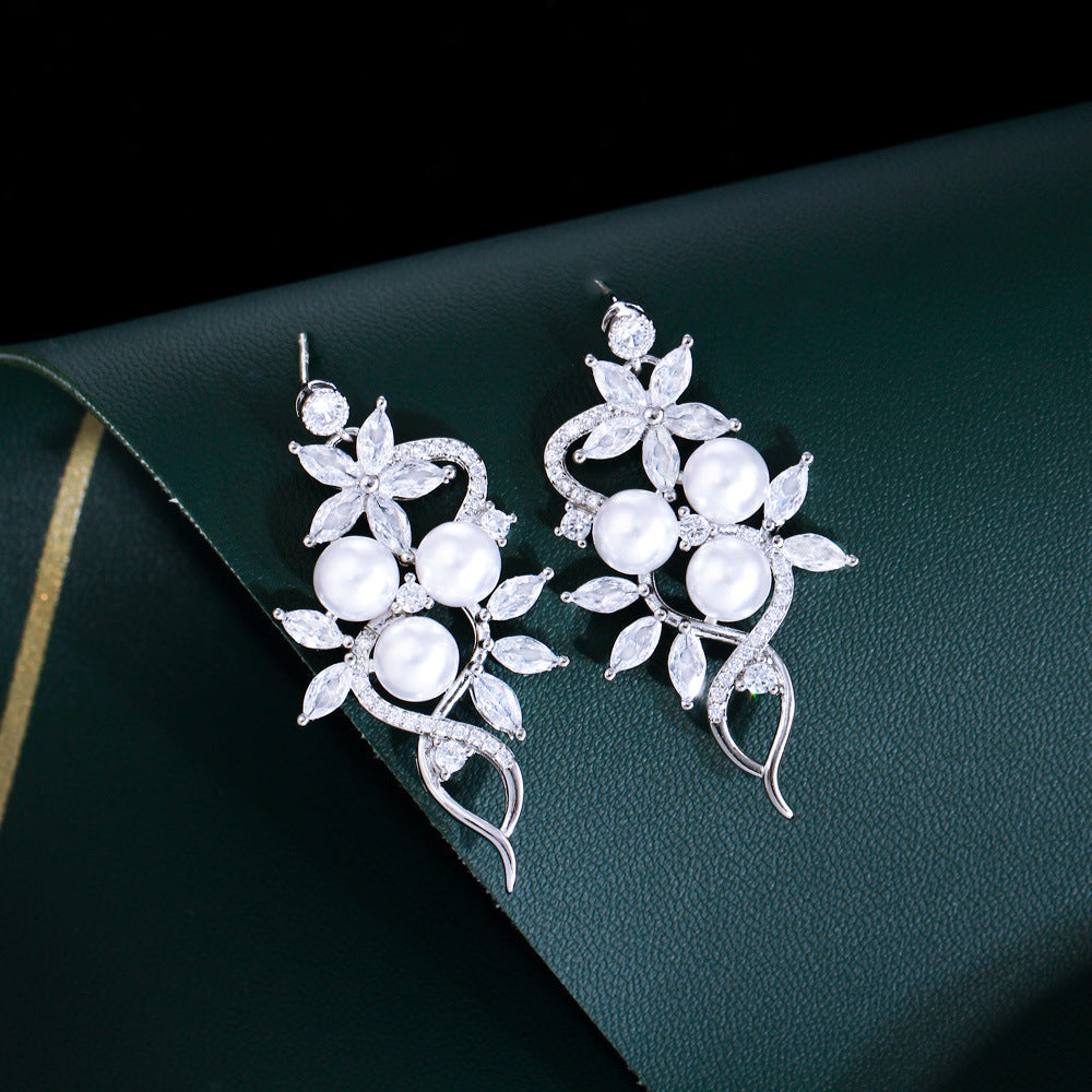 Korean high-class lady's pearl fringed drop earrings featuring mother-of-pearl elegant and sophisticated long-stemmed diamond-set earrings