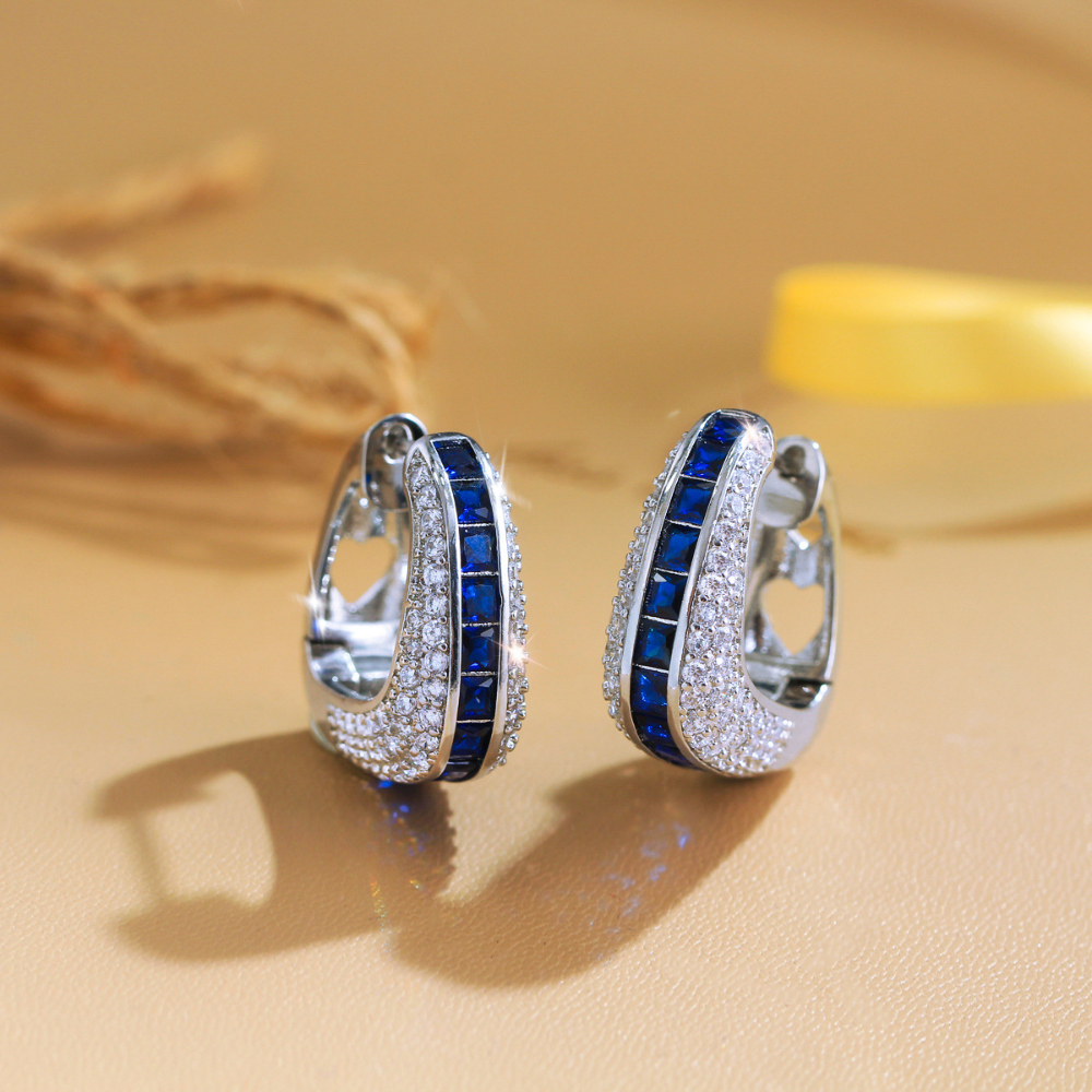 European and American full-circle square-shaped ear studs featuring bright blue zirconia This is a fashionable luxurious niche design in a sweet and cool style It is an earpiece accessory