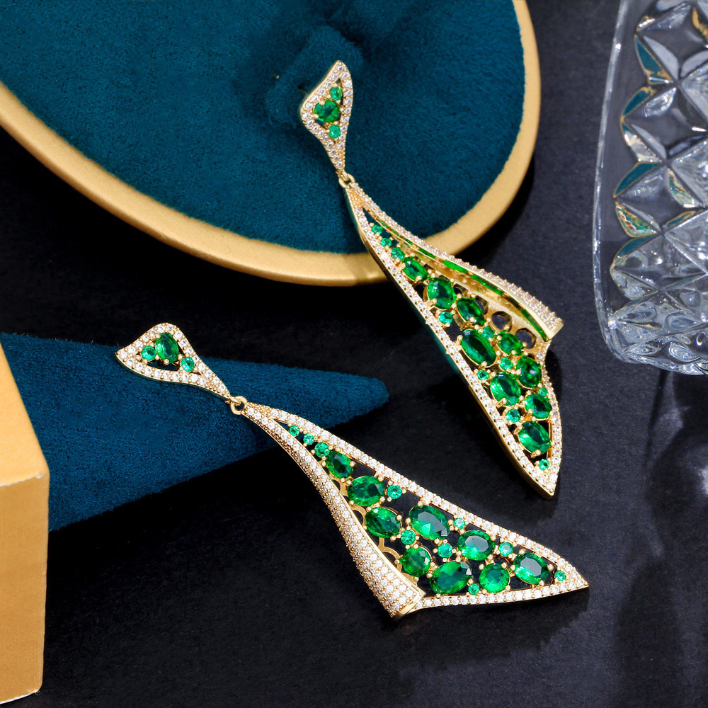 S925 silver jewelry - European Heavy Industry brand. Personalized green emerald earrings Trendy and luxurious featuring lightweight and high-end design With dangling zircon stones
