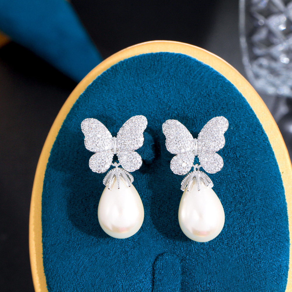 French-style bow-shaped pearl earrings with a sweet and elegant look featuring three-dimensional micro-set zirconia stones S925 silver stud earrings an extremely enchanting accessory