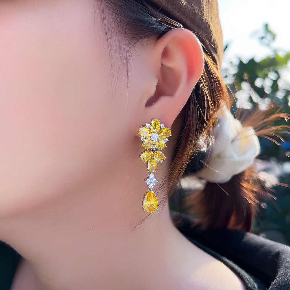 Japanese and Korean minimalist luxury long-flowing flower-shaped drop zirconia earrings with abundant diamonds, featuring elegant and versatile style, perfect for all occasions. Ear jewelry.
