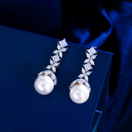 Korean high-class lady's pearl fringed drop earrings featuring mother-of-pearl elegant and sophisticated long-stemmed diamond-set earrings