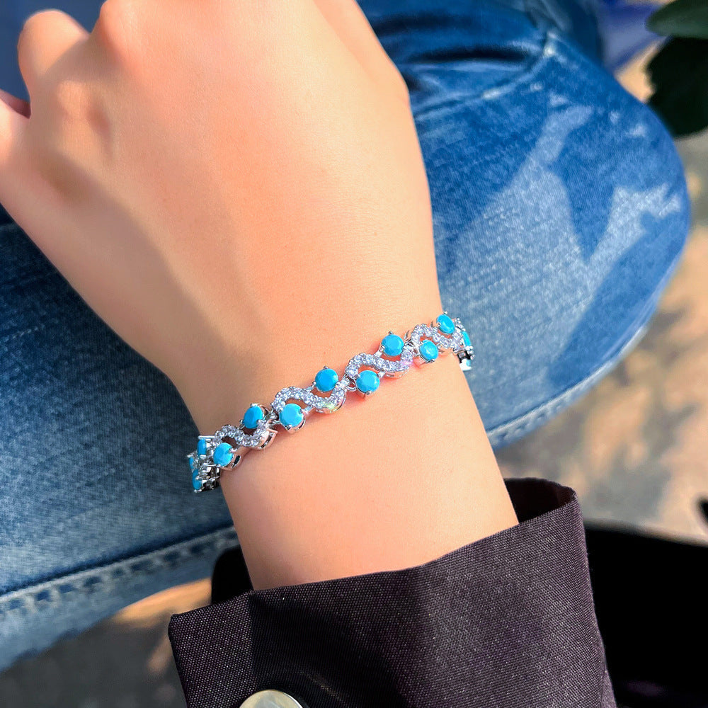 Vintage elegant court style blue turquoise S-shaped interlocking bracelet with high-end luxury feel and zirconium gemstone inlay