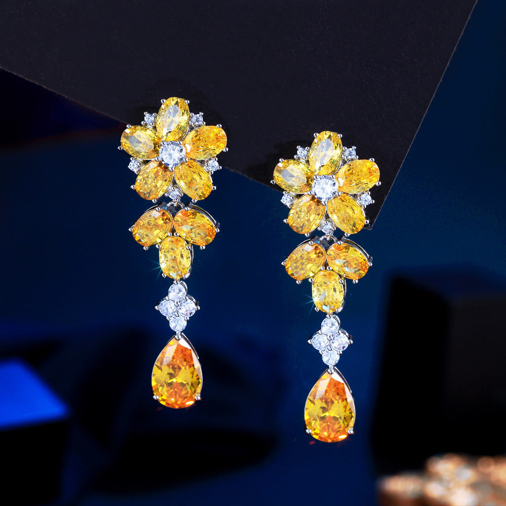Japanese and Korean minimalist luxury long-flowing flower-shaped drop zirconia earrings with abundant diamonds, featuring elegant and versatile style, perfect for all occasions. Ear jewelry.