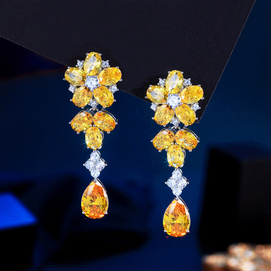 Japanese and Korean minimalist luxury long-flowing flower-shaped drop zirconia earrings with abundant diamonds, featuring elegant and versatile style, perfect for all occasions. Ear jewelry.