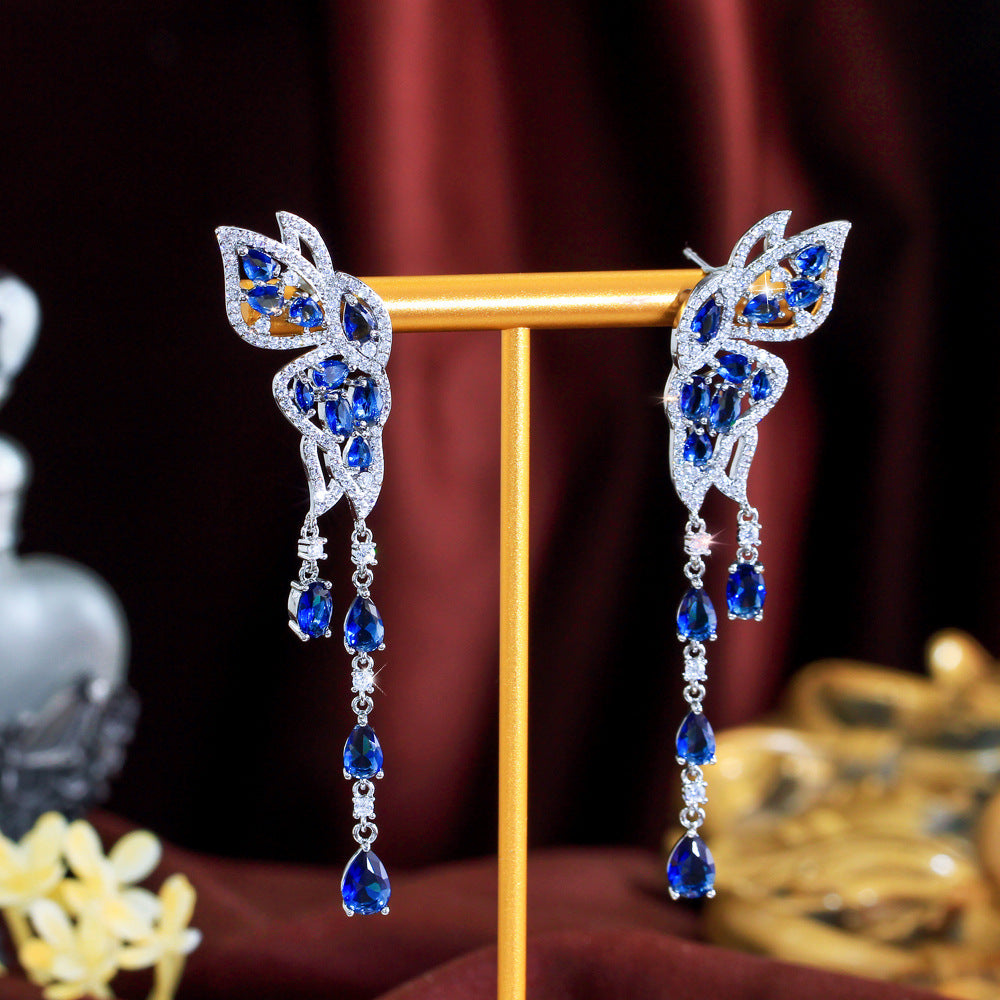 S925 silver needle long-style butterfly fringed earrings enhance facial shape and temperament They resemble a pair of flying swallows Drop earrings as an accessory for the ears