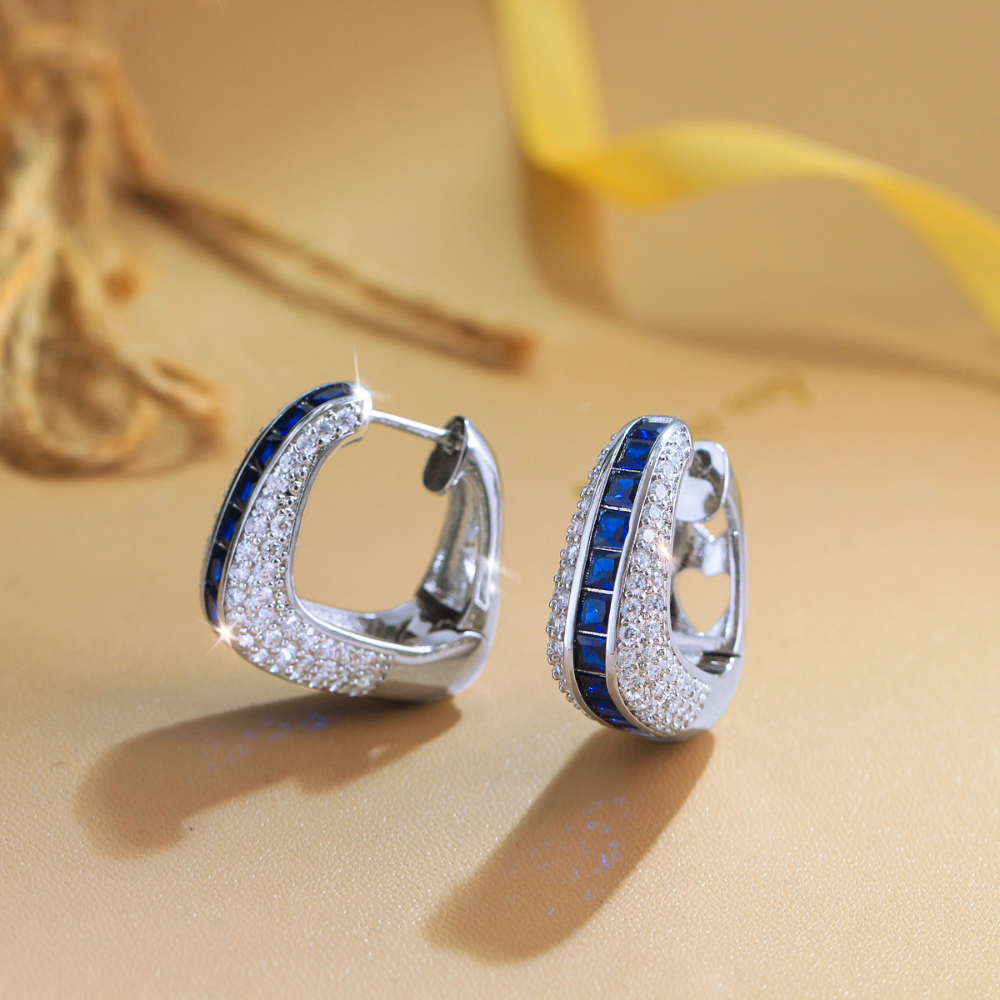 European and American full-circle square-shaped ear studs featuring bright blue zirconia This is a fashionable luxurious niche design in a sweet and cool style It is an earpiece accessory
