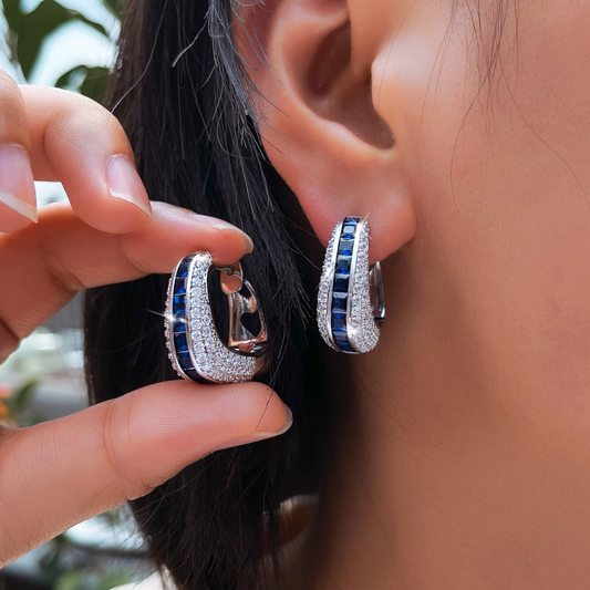 European and American full-circle square-shaped ear studs featuring bright blue zirconia This is a fashionable luxurious niche design in a sweet and cool style It is an earpiece accessory